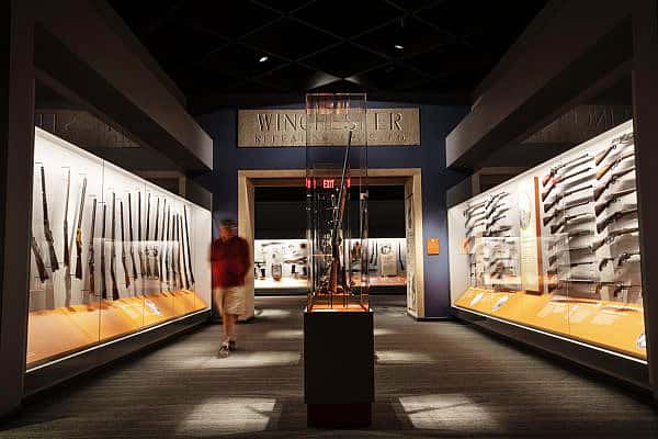 A visitor walks along the Cody Firearms Museum, a popular gun museum in Cody, WY.