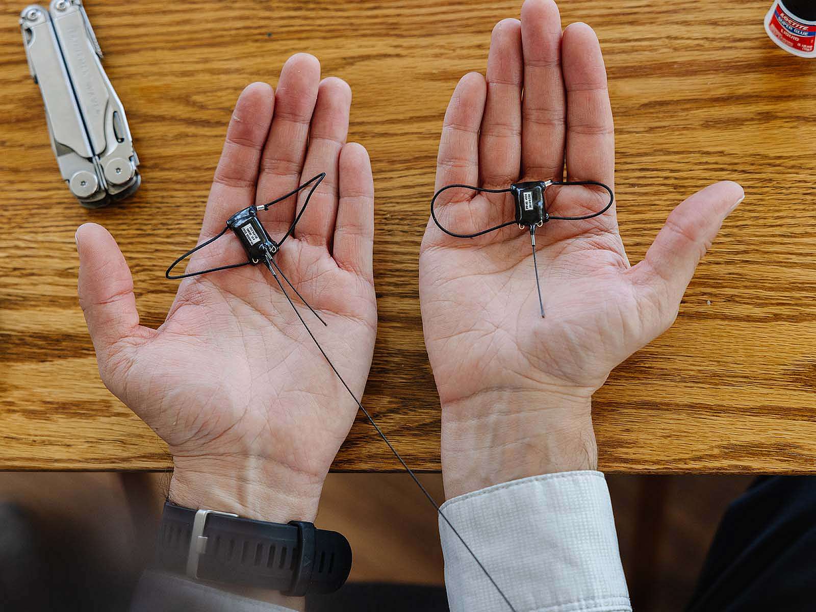 GPS tags shown in outstretched palms.