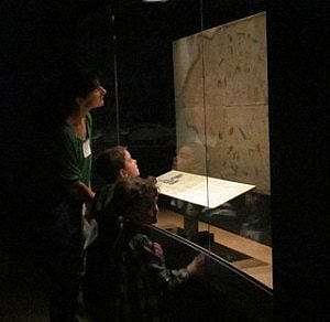 Plains Indian Museum visitors check out Lone Dog's winter count.