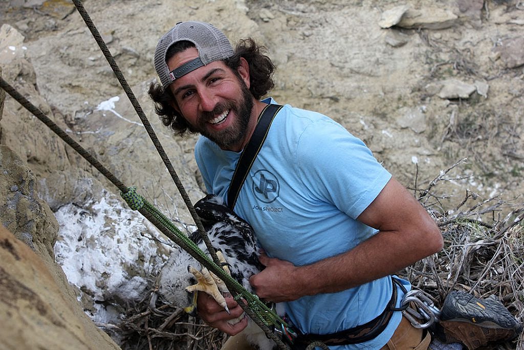 Team member and photographer Nick Ciaravella rappels down to an eagle nest. C.R. Preston photo.