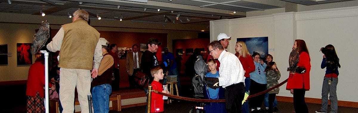 Visitors and volunteers interacting during our Holiday Open House.