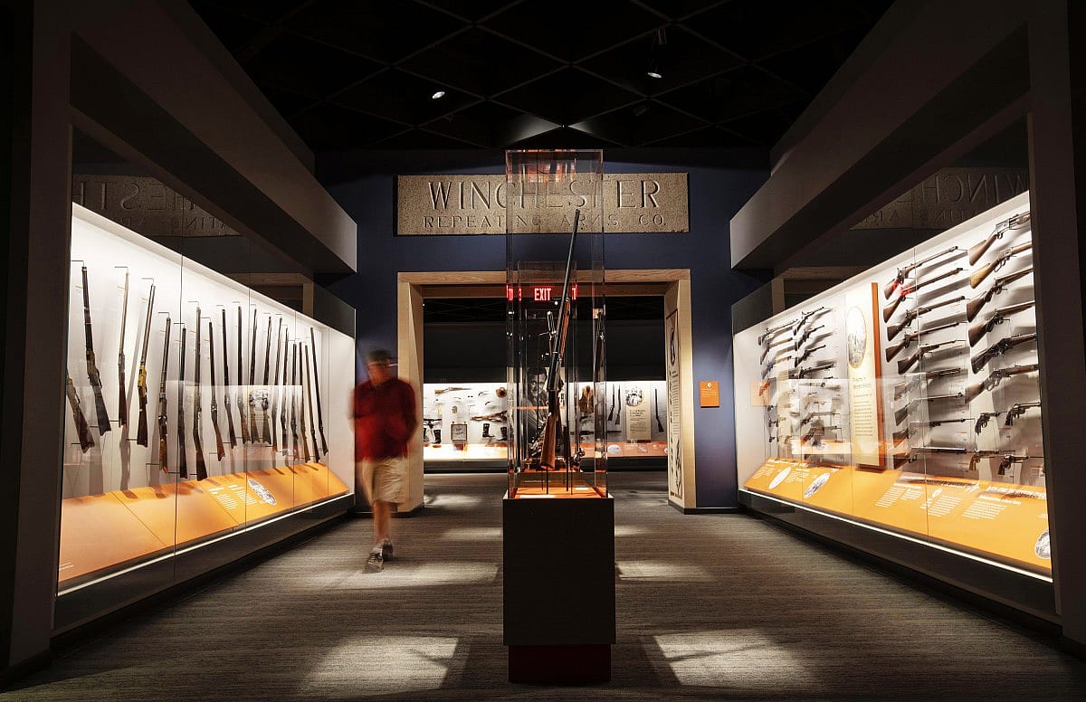 A visitor walks along the Cody Firearms Museum, a popular gun museum in Cody, WY.