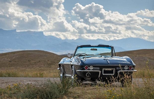 Black, 1966 Corvette convertible raffle car from the back.