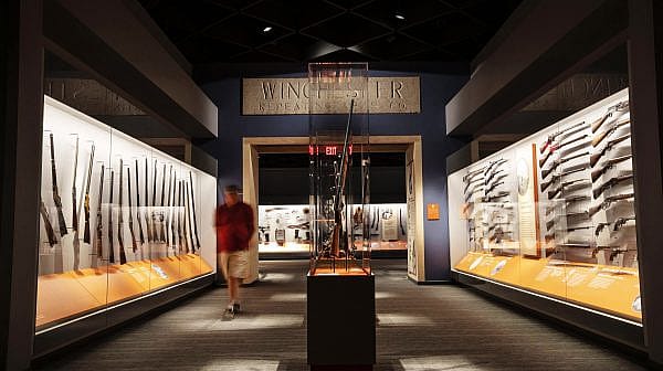 Cody Firearms Museum A visitor walks along the Cody Firearms Museum, a popular gun museum in Cody, WY.
