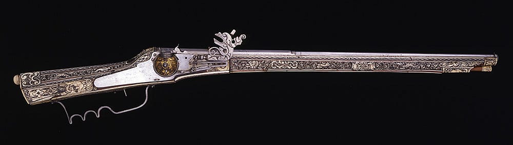This German wheellock musket with carved ivory stock and barrel depicting human figures, floral scrolls, and animals dates to 1596. Gift of Olin Corporation, Winchester Arms Collection. 1988.8.1028