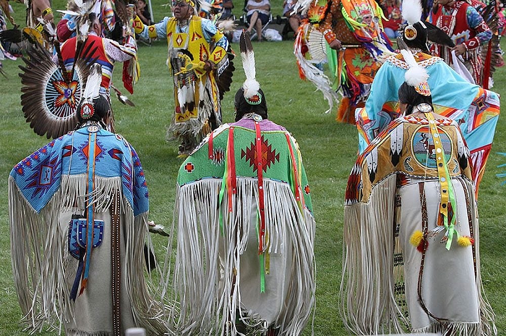 Dancers in traditional dance regalia at the Plains Indian Museum Powwow. Photo by Ken Blackbird.