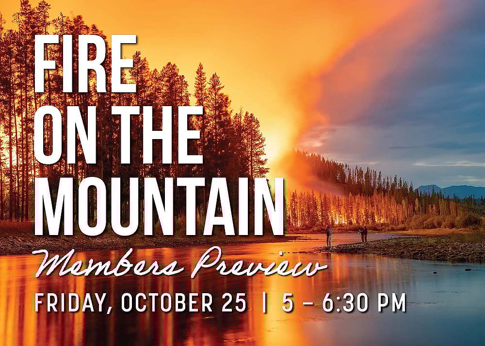 Fire, trees, river, overprinted with "Fire on the Mountain, Members Preview," and date.