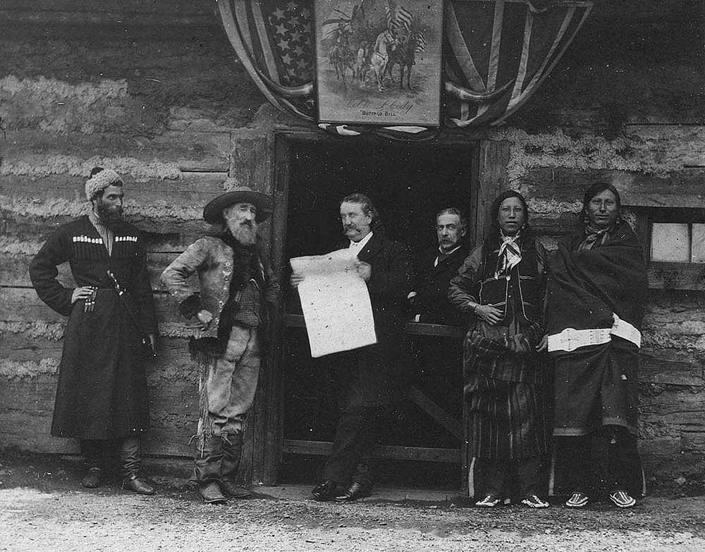 Buffalo Bill's Wild West personnel, ca. 1900. Second from left is John Nelson, stage driver, and third from left is Major Burke, press agent. Others are not identified. MS 6 William F. Cody Collection, McCracken Research Library. P.69.90