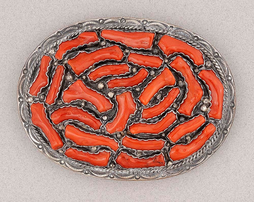 Silver belt buckle with twenty-four pieces of red branch coral, 20th century. Made by Evelyn Yazzie, Navajo silversmith. Gift of Margo Grant Walsh, in Appreciation of Ann Simpson. 1.69.6356