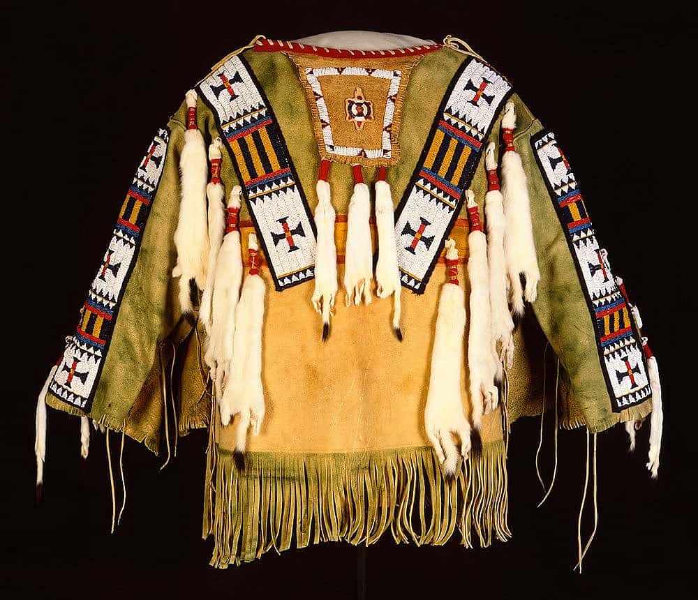 Man's Shirt. Austin Box, Southern Ute, Security, Colorado, 1989. Tanned deer hide, pre-1880 glass beads, seam binding, ermine, dyed porcupine quills, commercial dyes, nylon thread. Gift of Mr. & Mrs. William D. Weiss. NA.202.1007