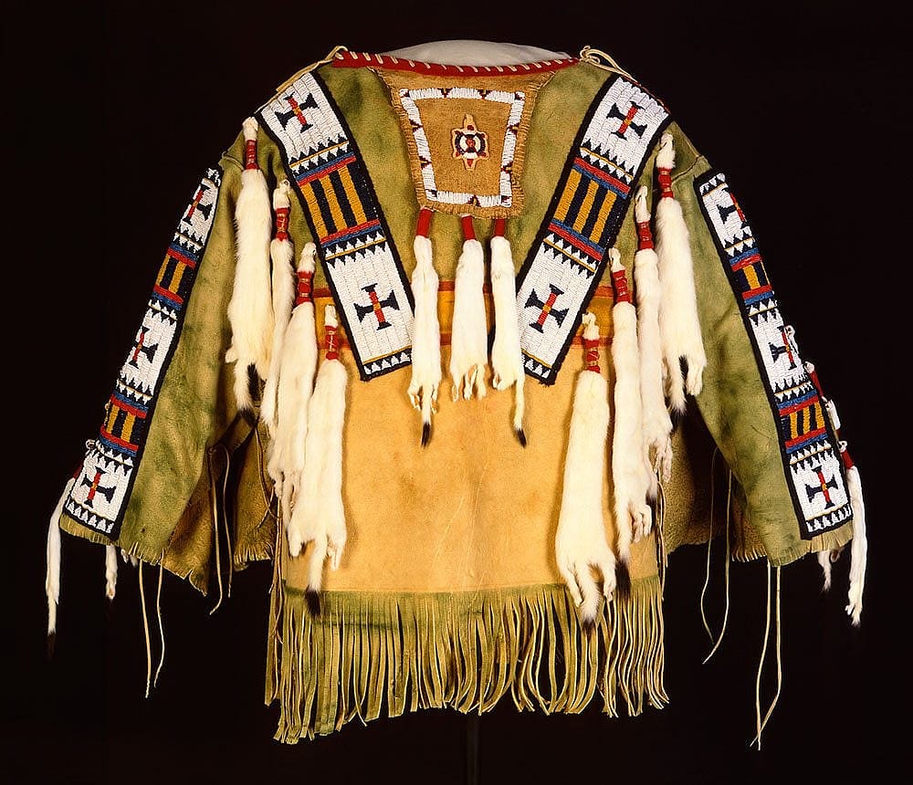 Man's Shirt. Austin Box, Southern Ute, Security, Colorado, 1989. Tanned deer hide, pre-1880 glass beads, seam binding, ermine, dyed porcupine quills, commercial dyes, nylon thread. Gift of Mr. & Mrs. William D. Weiss. NA.202.1007
