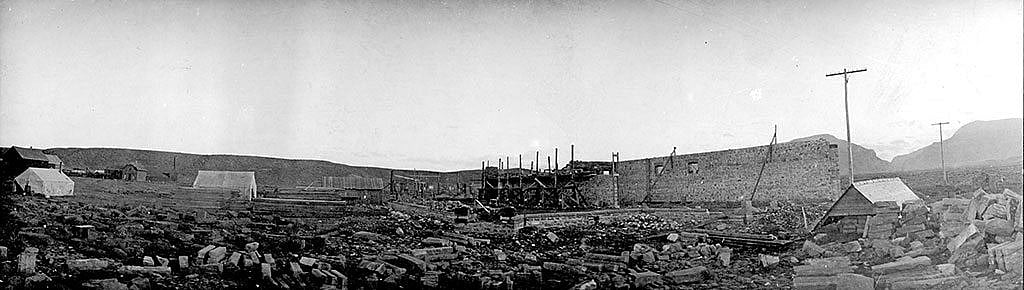 Construction site of the Irma Hotel with the completed western wall braced with timbers, 1901. MS 6 William F. Cody Collection. P.6.871