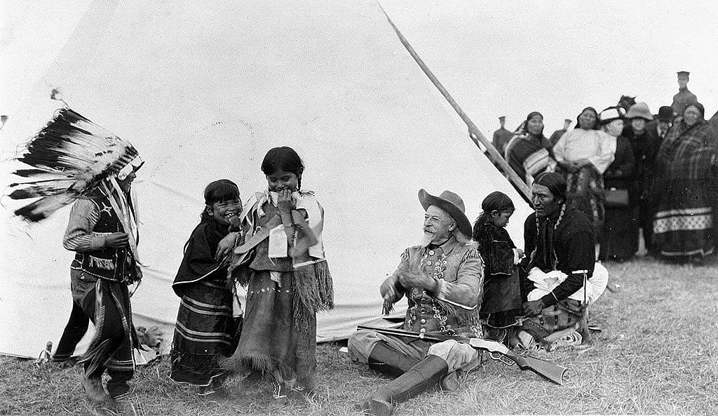 Buffalo Bill takes time to play with young American Indian children whose parents were more than likely actors in his Wild West, ca. 1913. MS 6 William F. Cody Collection. P.6.243