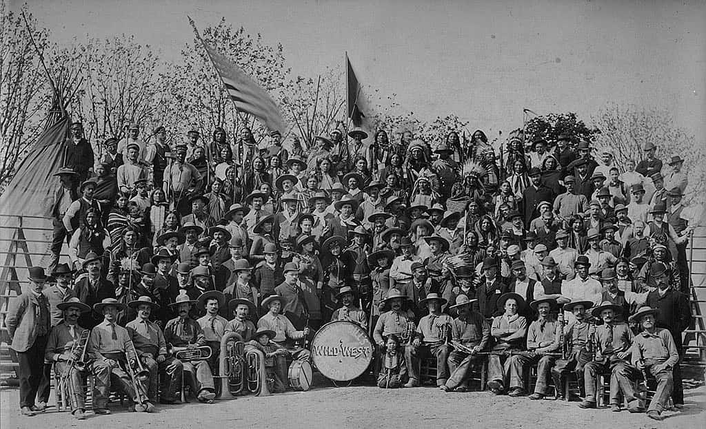 Cast of Buffalo Bill's Wild West in Milan, 1908. Annie Oakley is standing behind and to the left of the bass drum, with rifle over her shoulder. MS6 William F. Cody Collection. P.69.817