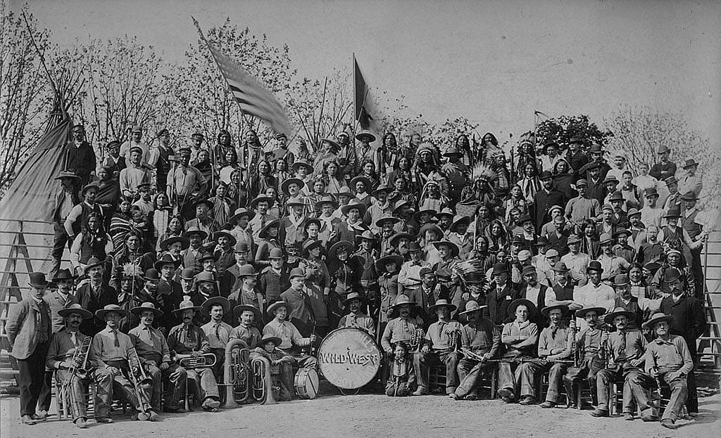 Cast of Buffalo Bill's Wild West in Milan, 1908. Annie Oakley is standing behind and to the left of the bass drum, with rifle over her shoulder. MS6 William F. Cody Collection. P.69.817