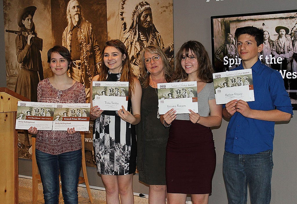 Contest winners pose with their teacher (center) and certificates. at the Center. Left to right: Emily Hollingshead, Trisha Tamblyn, Stephany Anderson, Victoria Ransom, and Matthew Dimsey.