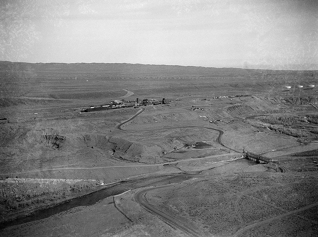 Aerial view of the Shoshone River on the north side of Cody and the Cody train station across the river, ca. 1930s. MS3 Charles Belden Collection. PN.67.739b.