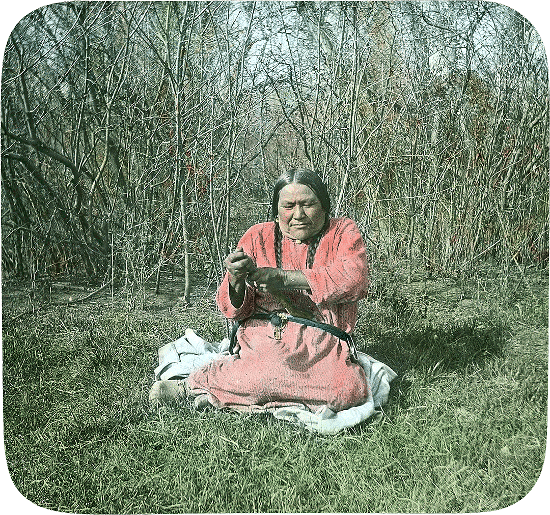Pretty Enemy demonstrating stomach stick used for physical ailments, ca. 1903-1925. LS.95.341 William A. Petzoldt Lantern Slide Collection. LS.95.341