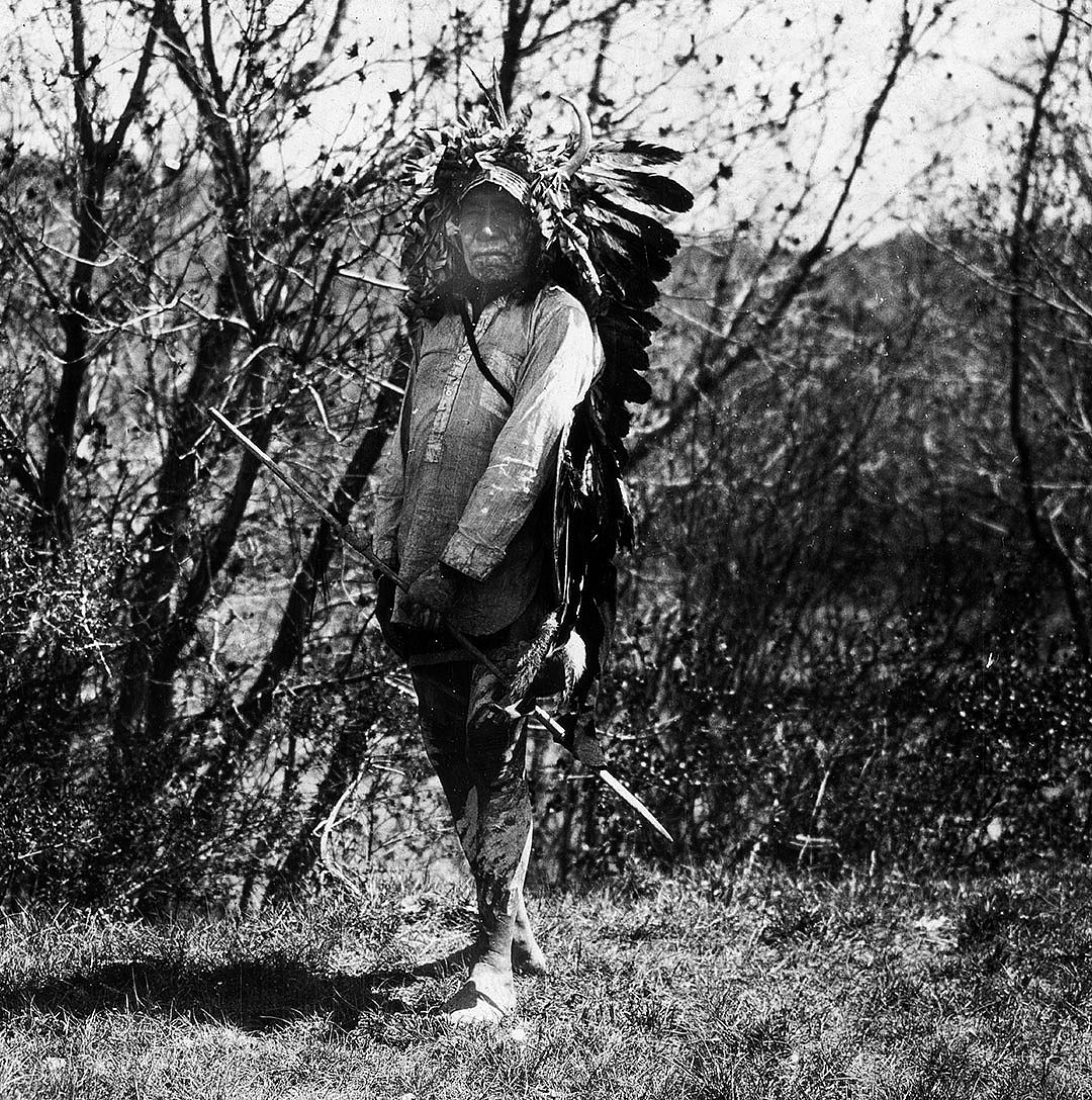 Crow man carrying lance, ca. 1903-1925. MS 95 William A. Petzoldt Lantern Slide Collection. LS.95.377