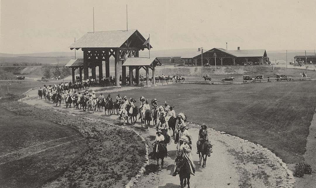 Blackfoot Indians and others participate in ceremonial parade at Glacier National Park, 1910-1920. MS 320 Paul Dyck Plains Indians Buffalo Culture Collection. P.320.138