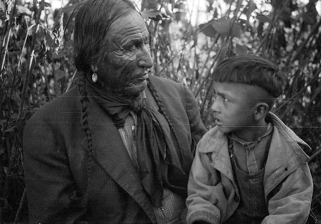 Elder sitting with boy, ca. 1922-1935. MS 165 Thomas B. Marquis Collection. PN.165.1.47