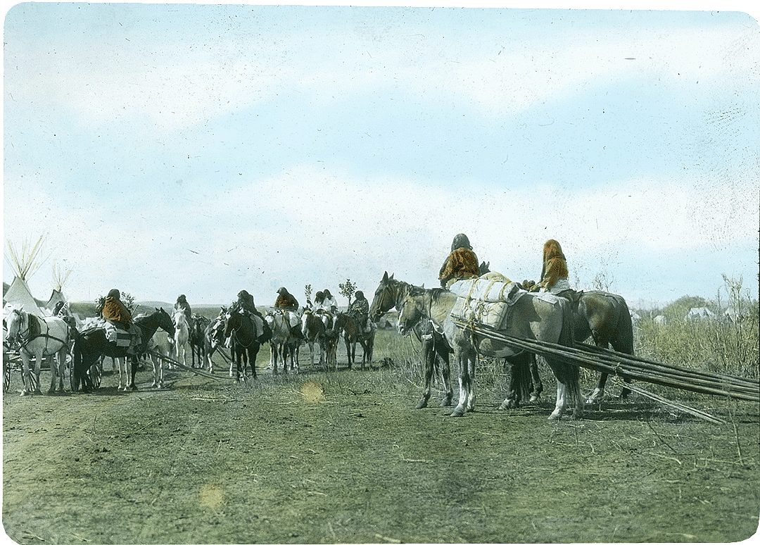 Moving camp, Absaroke (Crow). Colorized lantern slide. MS 95 William A. Petzoldt Lantern Slides Collection. LS.95.293