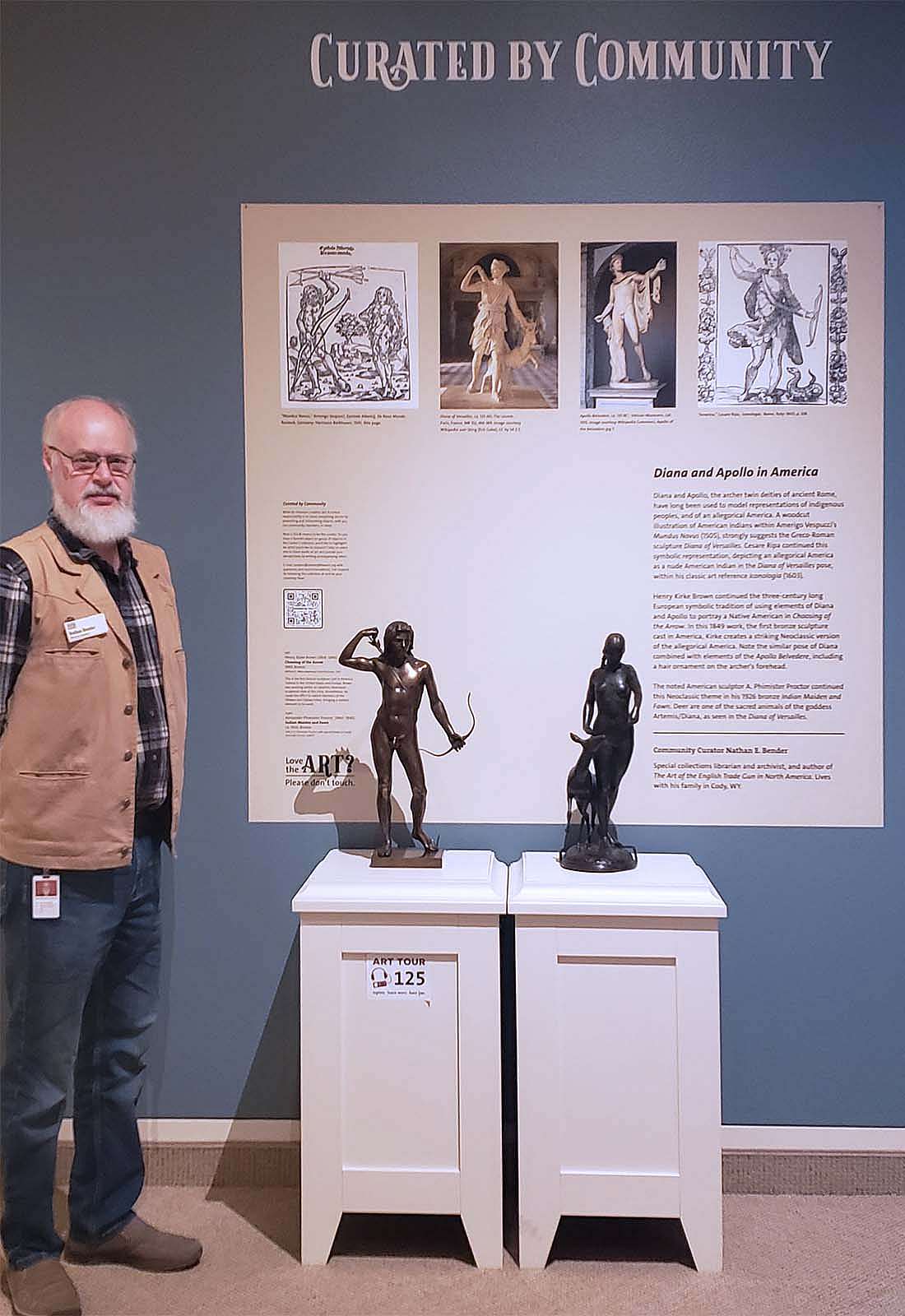 Nathan Bender with his Curated by Community exhibit in the Whitney Western Art Museum.