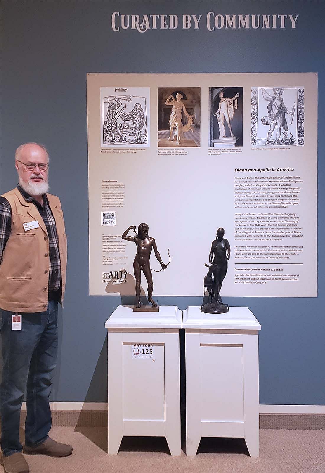 Nathan Bender with his Curated by Community exhibit in the Whitney Western Art Museum.