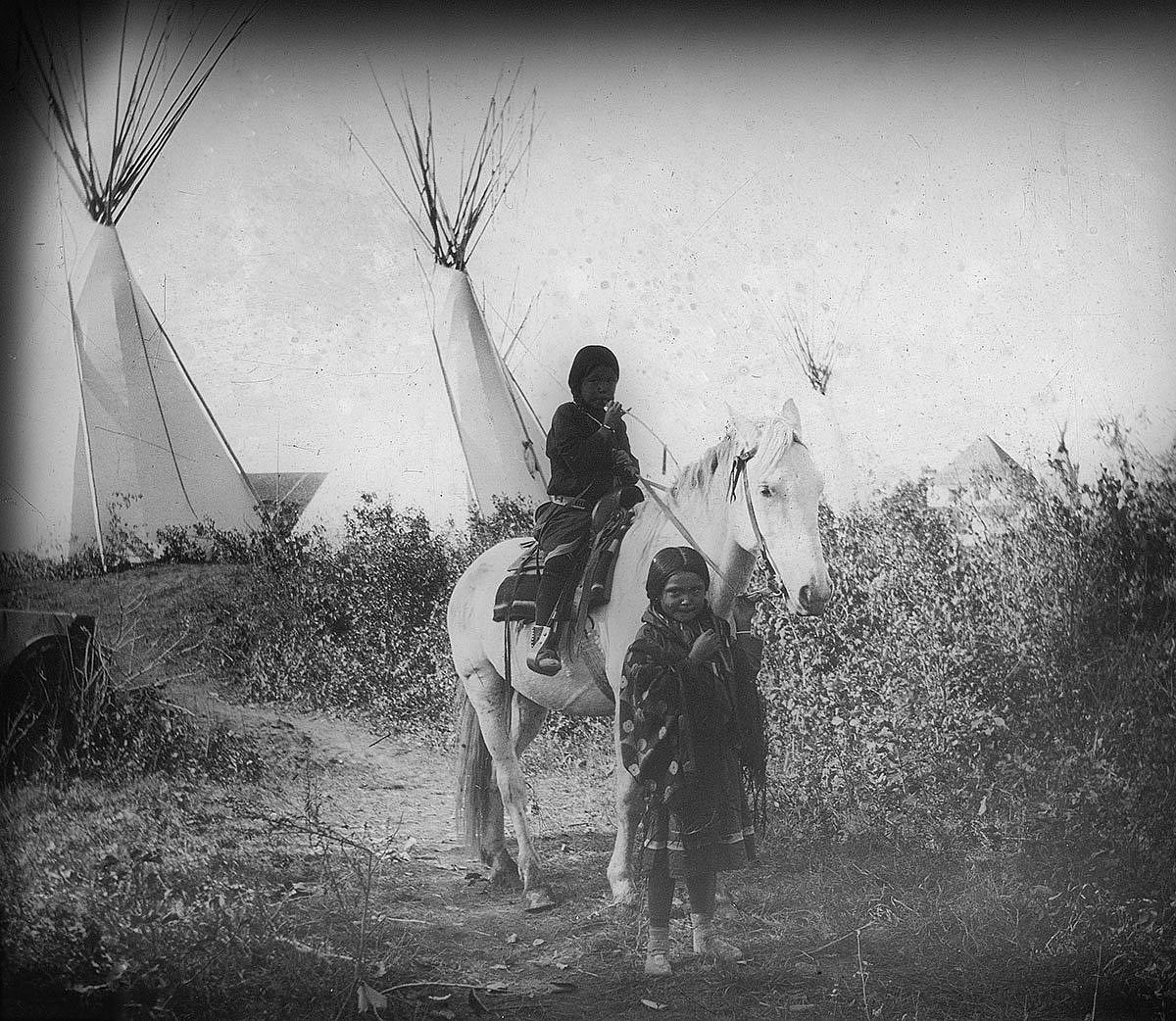 Crow children on horseback, ca. 1903-1925. MS 95 William A. Petzoldt Lantern Slide Collection. LS.95.385