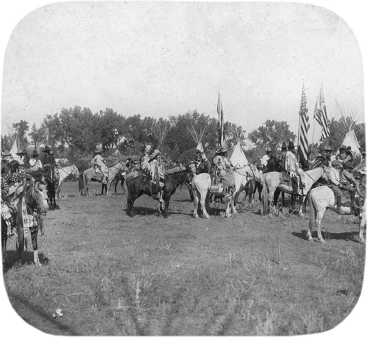 Crow people in traditional regalia for parade, ca. 1903-1925. MS 95 William A. Petzoldt Lantern Slide Collection. LS.95.393
