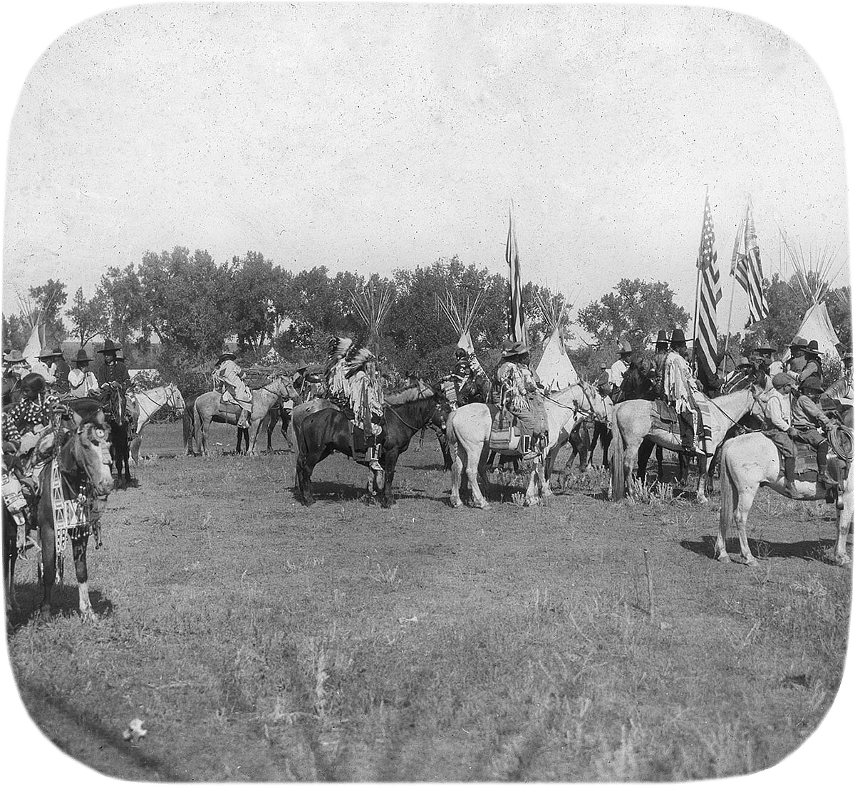 Crow people in traditional regalia for parade, ca. 1903-1925. MS 95 William A. Petzoldt Lantern Slide Collection. LS.95.393