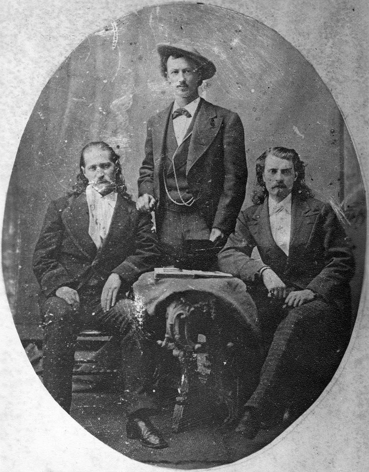 Black and white studio photograph of James Butler "Wild Bill" Hickok, John B. "Texas Jack" Omohundro, and William F. "Buffalo Bill" Cody. MS 6 William F. Cody Collection. P.69.1170