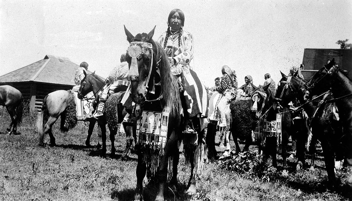 Absaroke (Crow) girl on horse at Crow Fair, Crow Agency, Montana. Photo by W.H.D. Koerner, 1927. P.78.4463