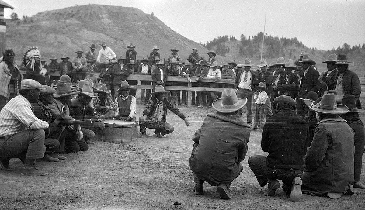 Cheyenne men and Crow men playing hand-game against each other at Cheyenne Fair in Lame Deer, Montana, 1928. MS 165 Thomas B. Marquis Collection. PN.165.1.32