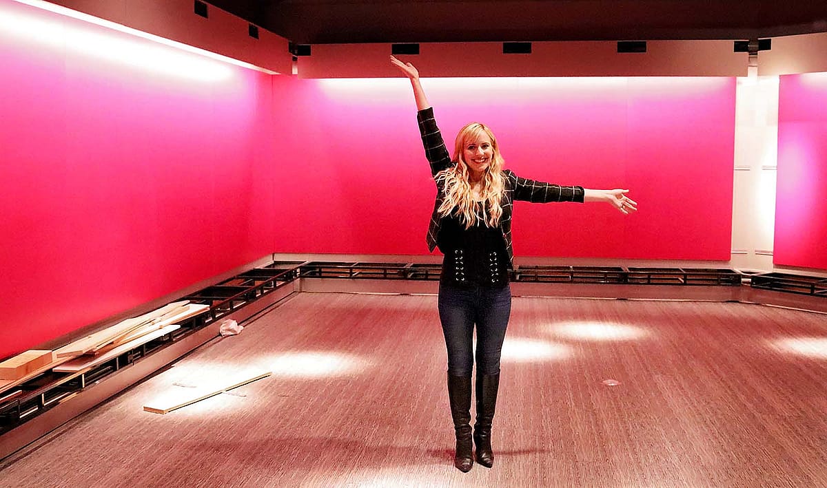 Vibrant pink walls await the installation of embellished and engraved firearms.
