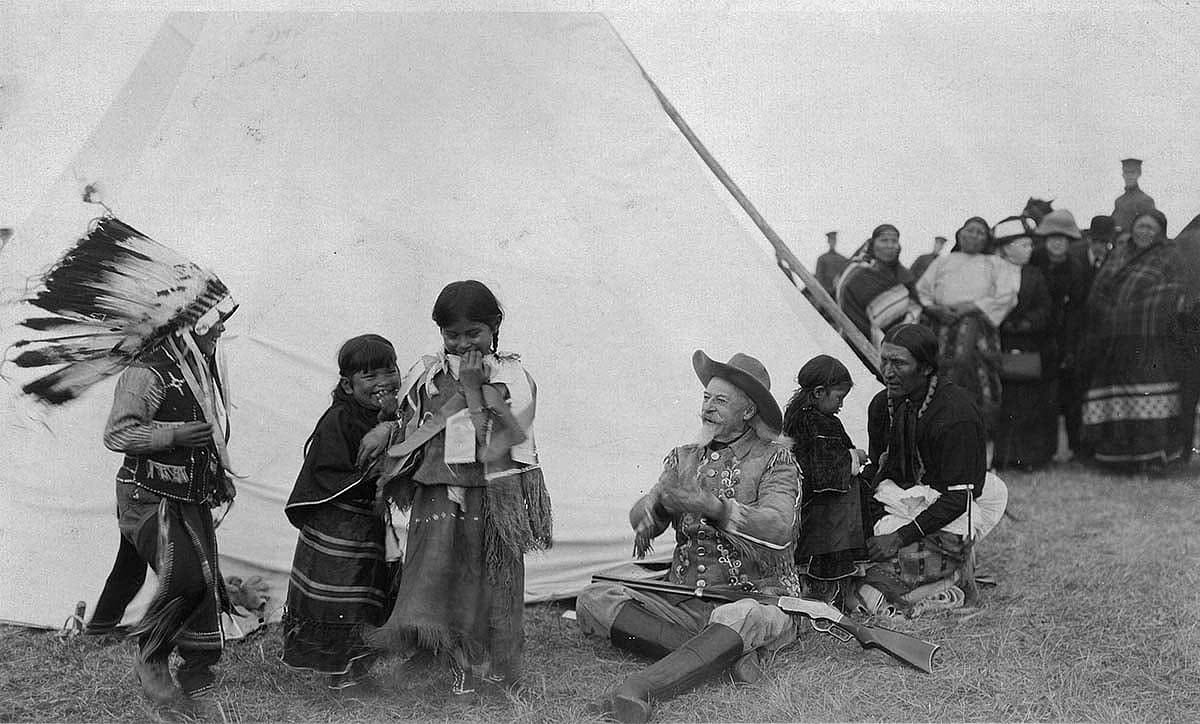 Buffalo Bill with Indian children at his Wild West, ca. 1915. MS6 William F. Cody Collection, McCracken Research Library. P.6.0243