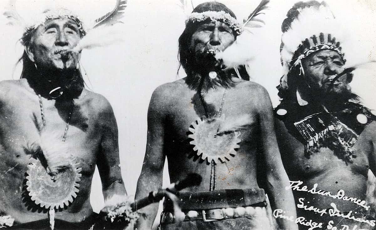 Three Sioux Sun Dance participates with eagle whistles, ca. 1894-1904. MS 320 Paul Dyck Plains Indian Buffalo Culture Collection. P.320.447