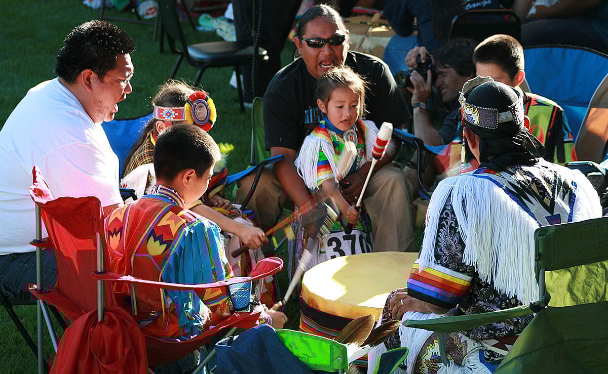 Multi-generational drum group at the 2010 Plains Indian Museum Powwow.