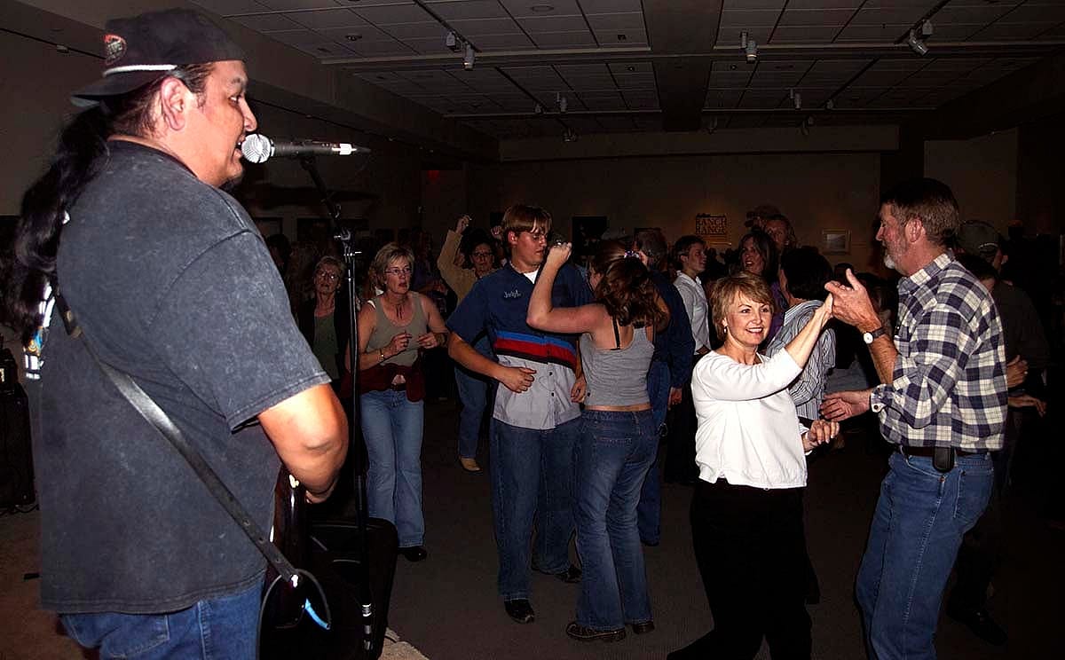 Concert-goers take to the floor to dance during the September 30, 2004, concert at the Center. Chris Gimmeson photo.