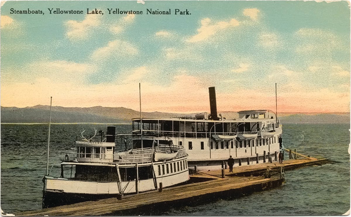 Pictured here are two of Yellowstone Lake's noted steamboats, the "Zillah" (foreground) and the "E.C. Waters." The story of the latter's namesake is one filled with hare-brained ideas, political intrigue, and entrepreneurship run amok. Leslie Quinn collection, ca. 1907. National Park Service (NPS) image.