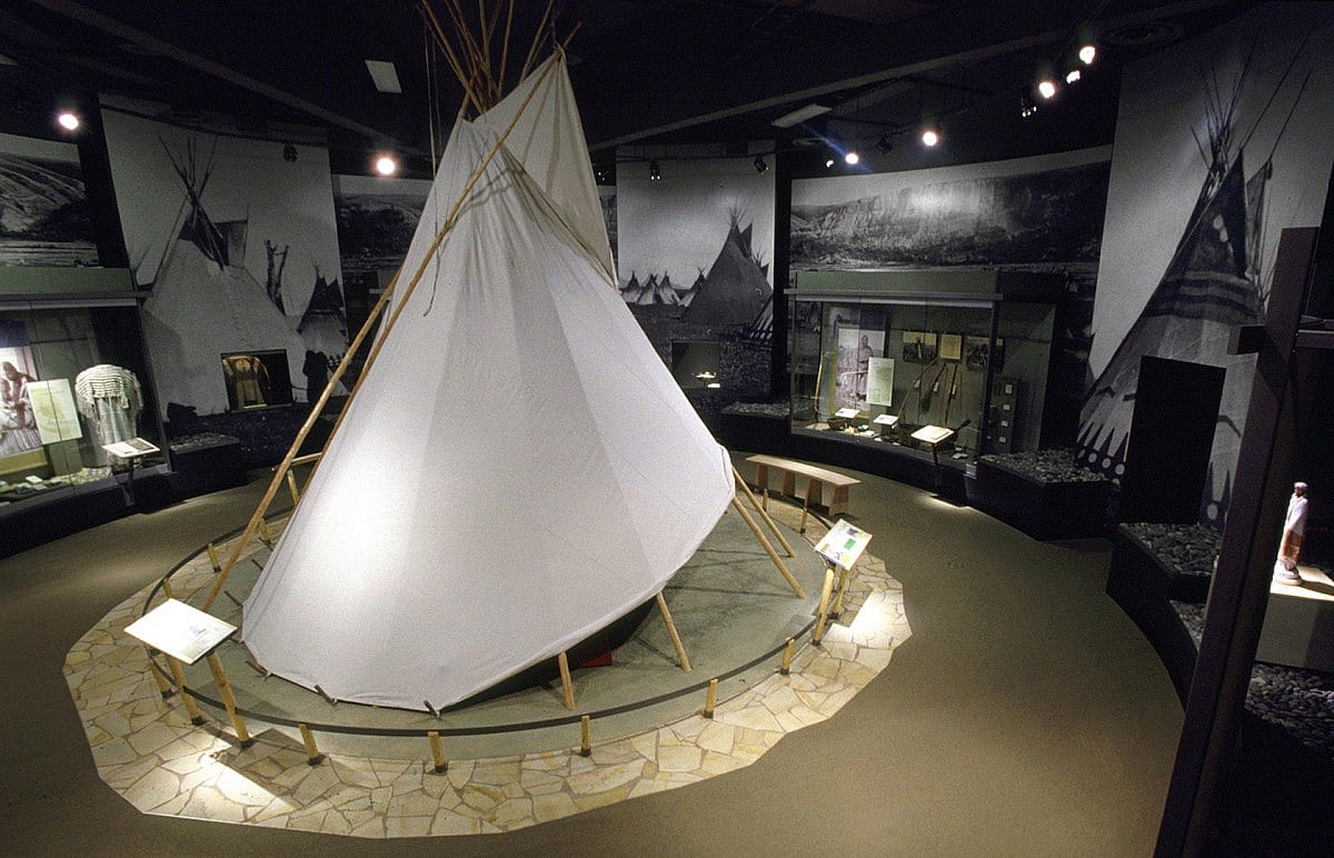 The centerpiece of the Plains Indian Museum's Land of Many Gifts gallery is an Apsaalooke Ashtaale (Crow Lodge or Tipi), one of the most beautiful and practical shelters ever invented. The voice of Alma Snell (Apsaalooke), granddaughter of Pretty Shield, speaks about life in a lodge, and Louella Johnson (Apsaalooke), sings lullabies.