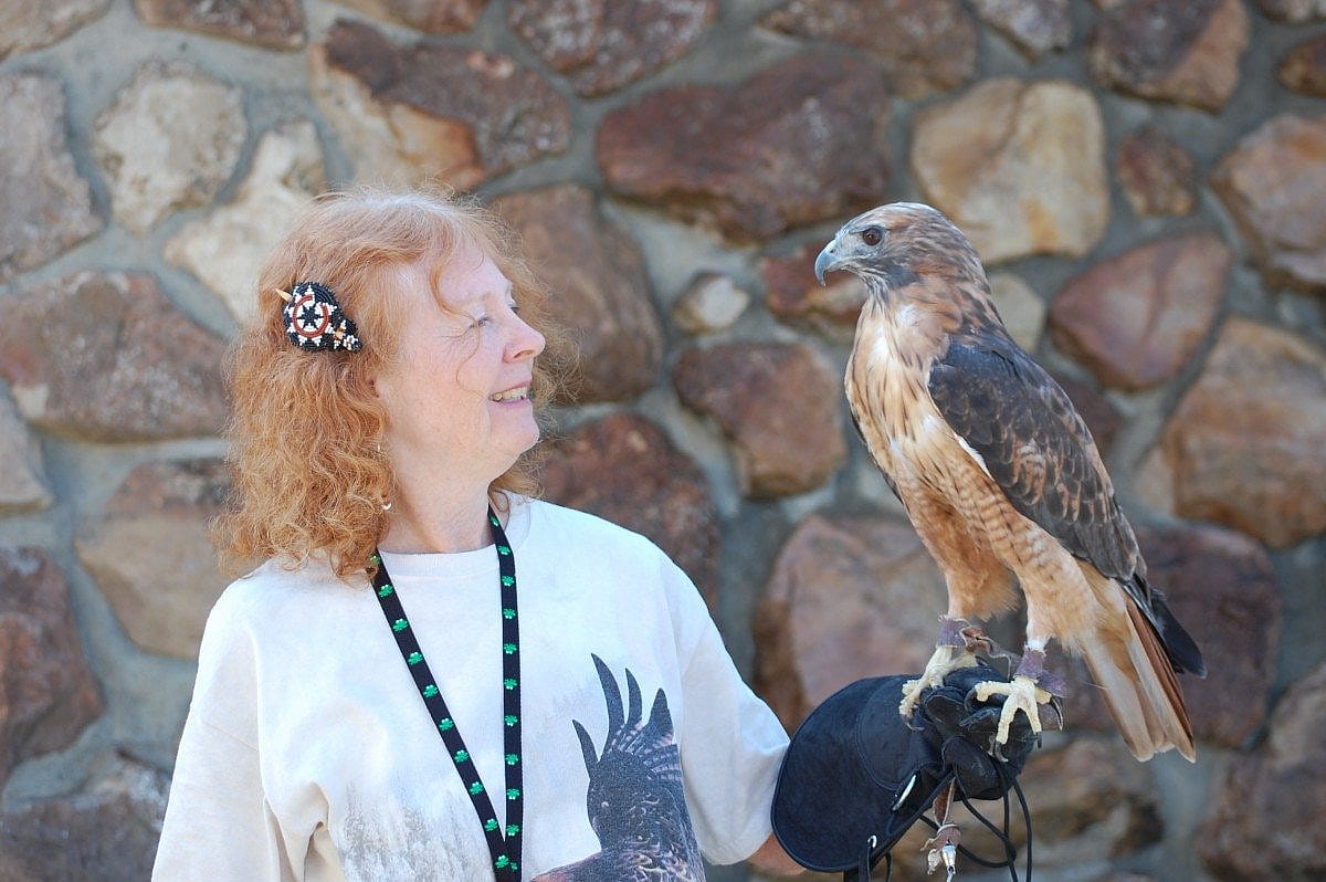 Volunteer Anne is excited to work with the birds.