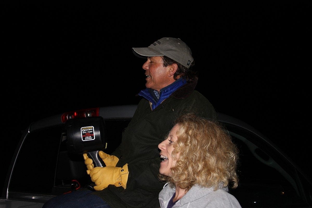 Golden Eagle Posse members Dave Beckett and Barb Grant prepare for one of our nighttime roadside rabbit surveys
