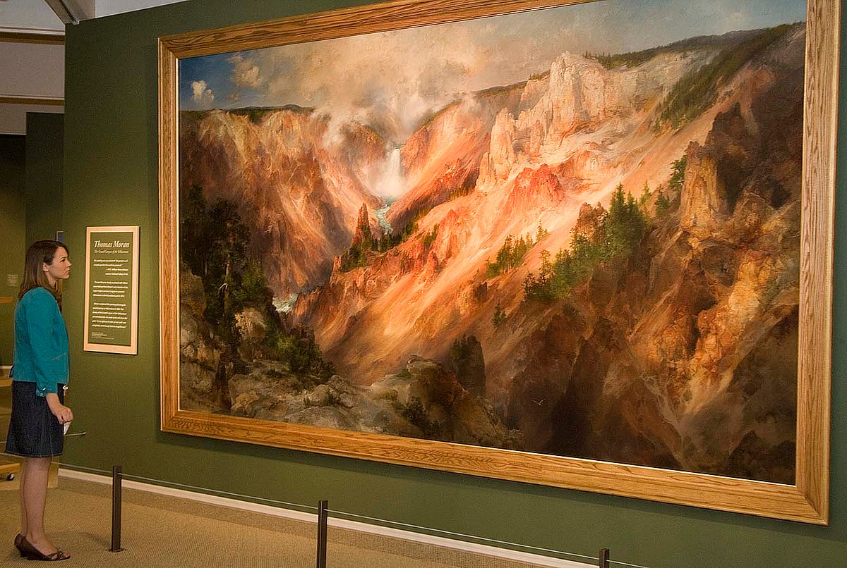 The author with her own "sense of wonder" at Thomas Moran's (1837-1926) "The Grand Canyon of the Yellowstone," 1893-1901, an eight feet high and fourteen feet long masterpiece, which was on display at the Center June through October 2009. Oil on canvas, 96.5 x 168.375 inches. Smithsonian American Art Museum. Gift of George D. Pratt. 1928.7.1