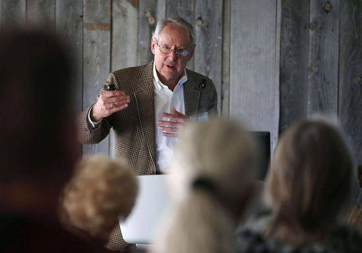 Peter Hassrick speaking before a group of people.