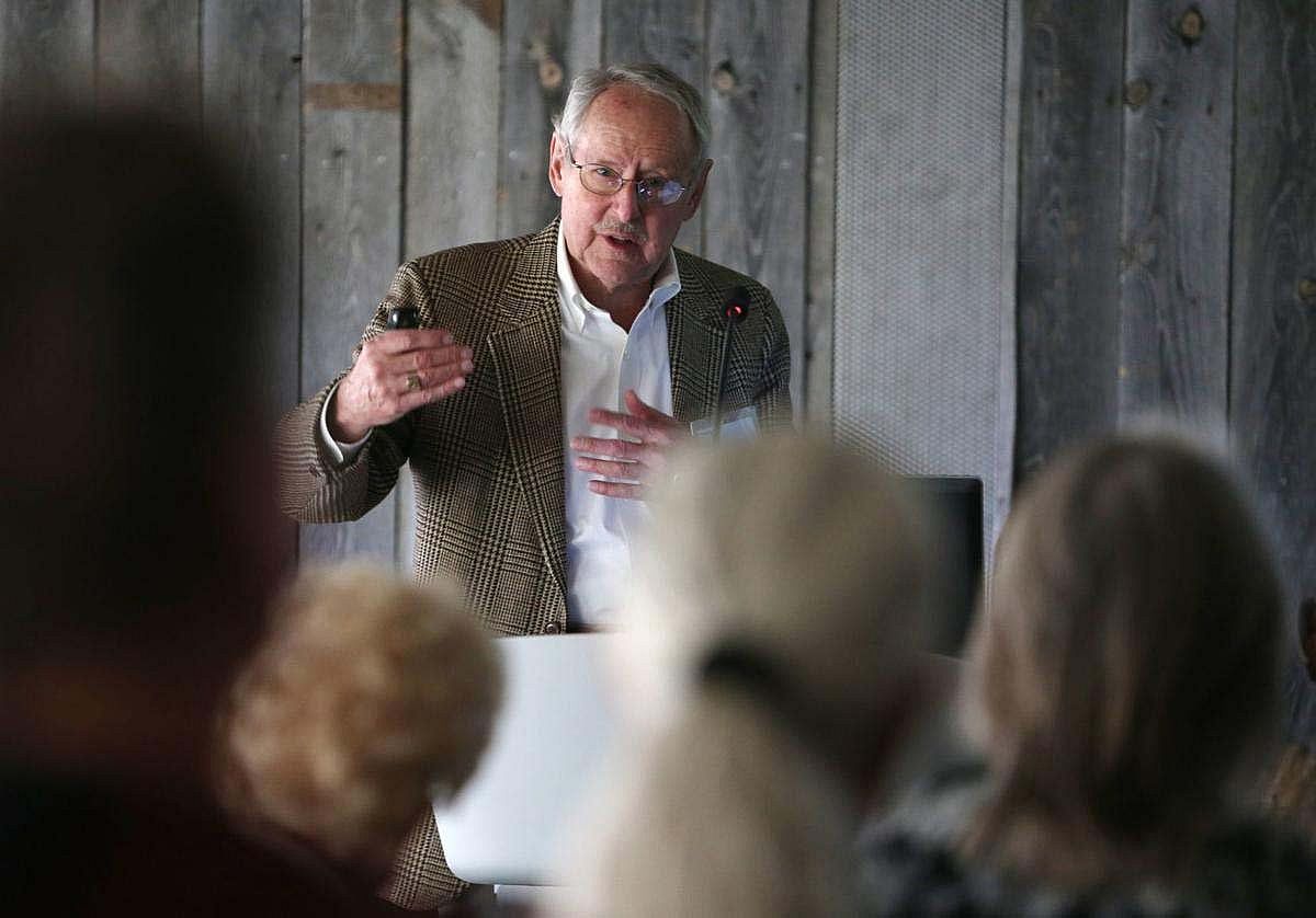 Peter Hassrick speaking before a group of people.