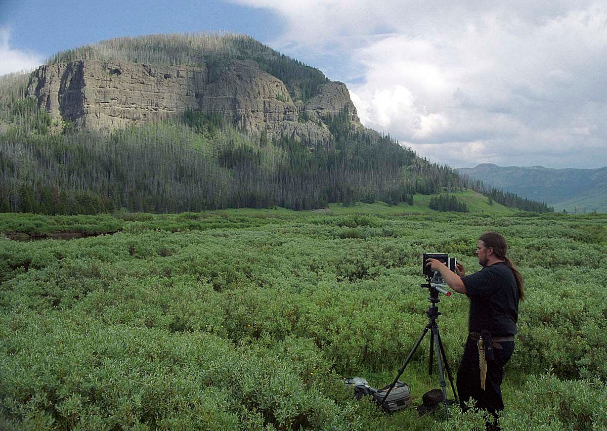 Center Photographer Sean Campbell gets positioned to replicate one of Jack Richard's historic photographs. Photograph by Nathan Bender.