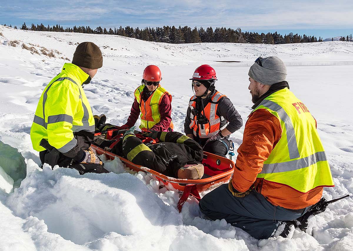 Search and Rescue volunteers in Yellowstone National Park train for a winter rescue operation. NPS photo/Jacob W. Frank.