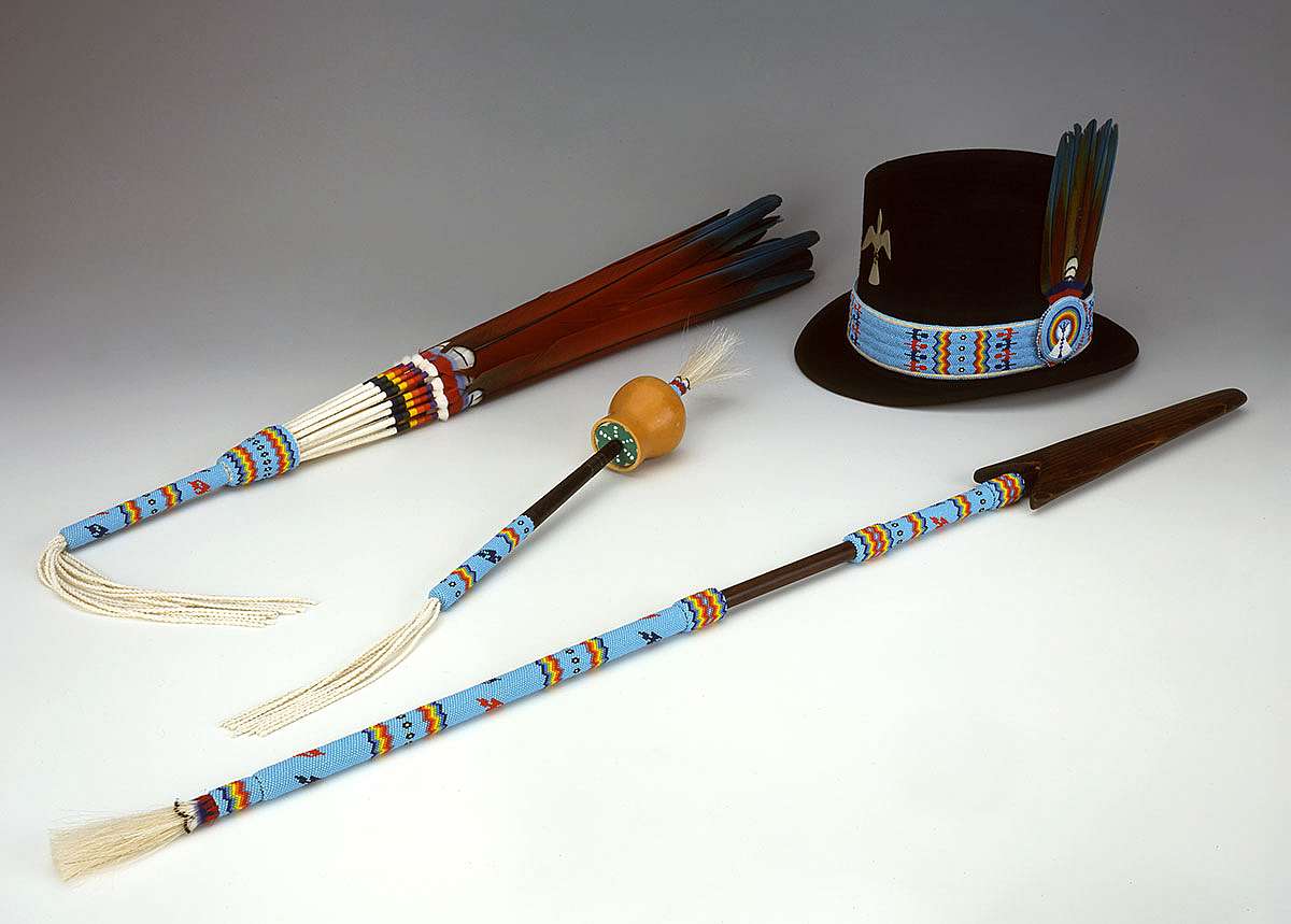 Native American Church set, 1998. Made by Emil Her Many Horses, Oglala Sioux. Feathers, glass beads, deer hide, metal, string. Gift of the Pilot Foundation. NA.502.215.1, .3, .4, and .5