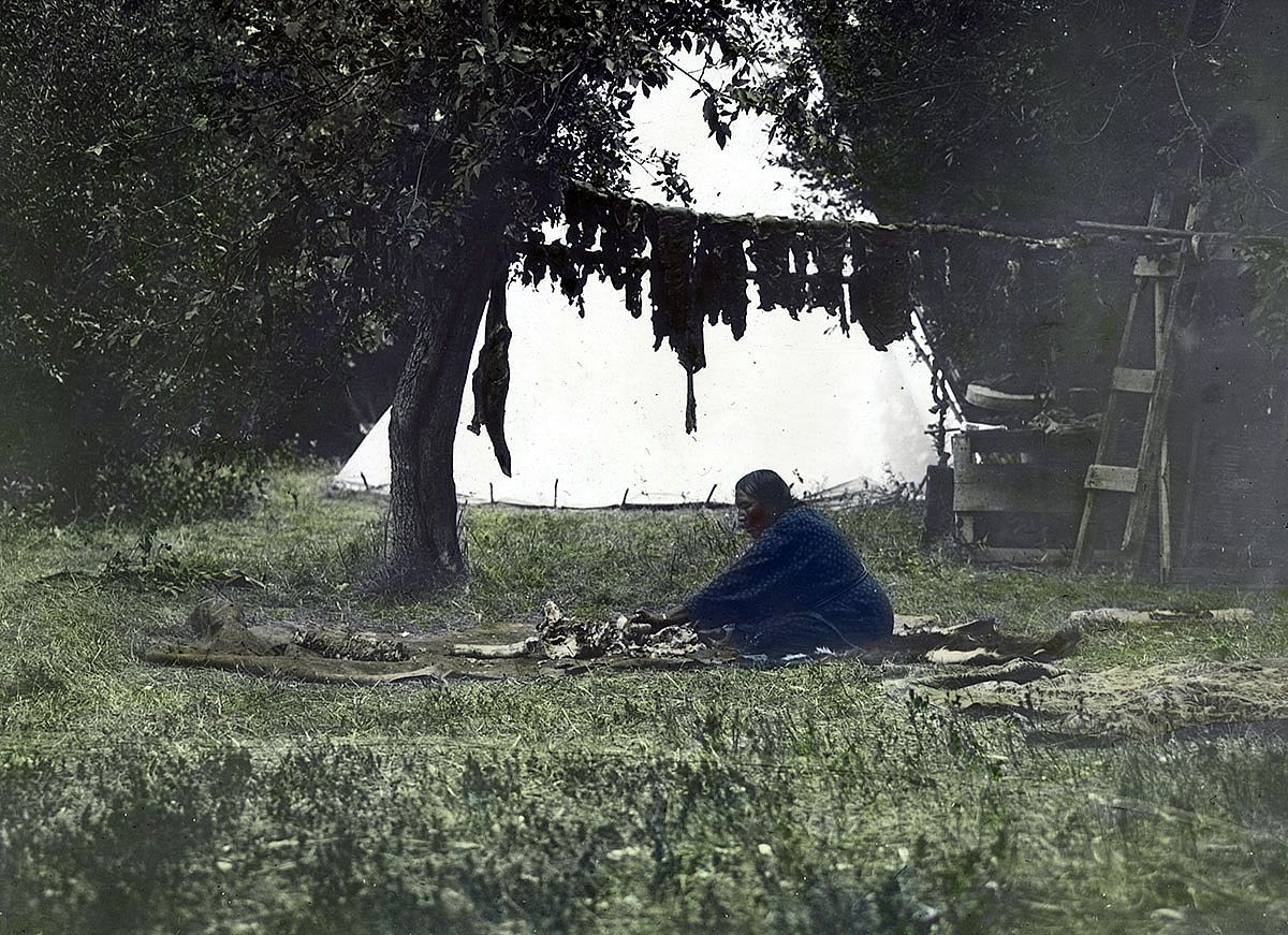 Working on hides and bones as meat hangs to dry, ca. 1903-1925. MS 95 William A. Petzoldt Lantern Slide Collection. LS.95.85
